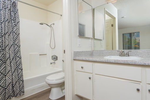 Bathroom with sink, toilet and shower at Woodbend, California, 91701