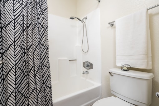 Bathroom with toilet and shower at Woodbend, Alta Loma, CA