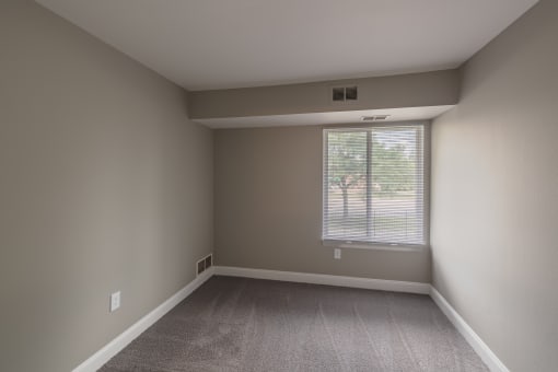 an empty room with a window in it
