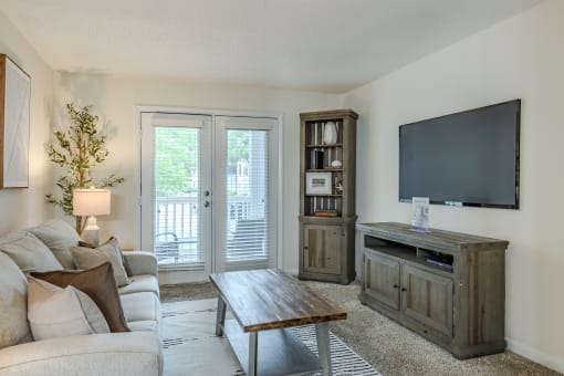 a living room with a couch and a tv