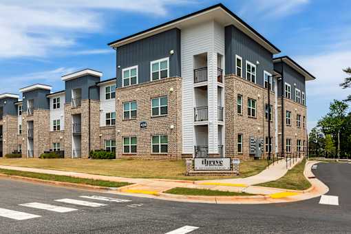 A large apartment complex with the name "Crestmoor" on the front.