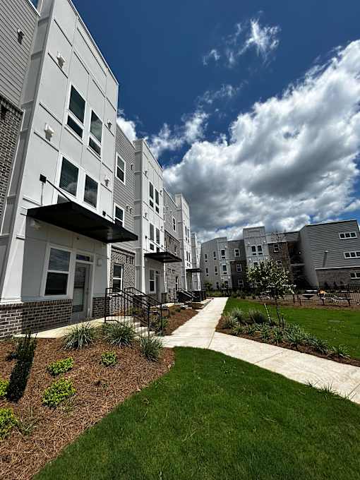 a view of an apartment building from the ground