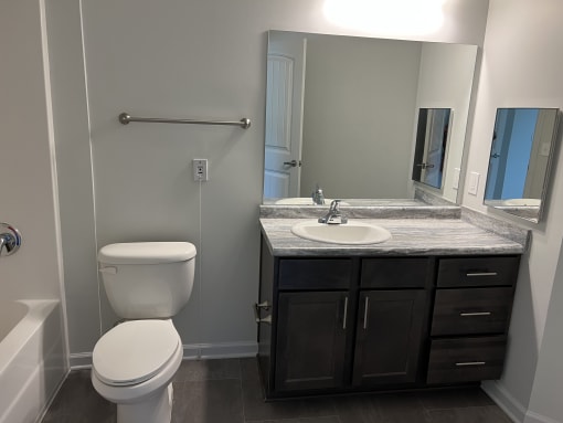 a bathroom with a toilet sink and bathtub