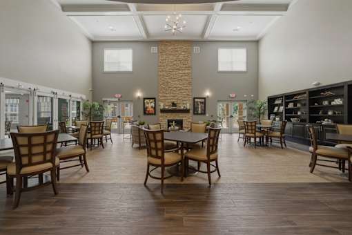 A large room with wooden floors and furniture.