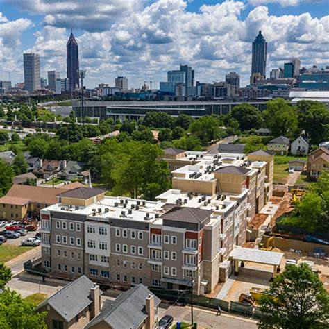 A cityscape with a mix of residential and commercial buildings.