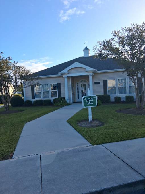 A white building with a sign that says "County Office".