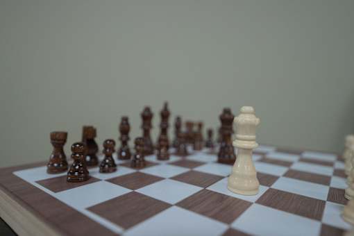 A chessboard with pieces in the middle of a game.
