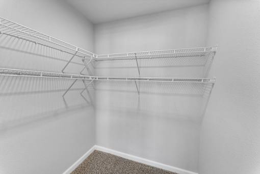 Empty white shelving unit in a room.