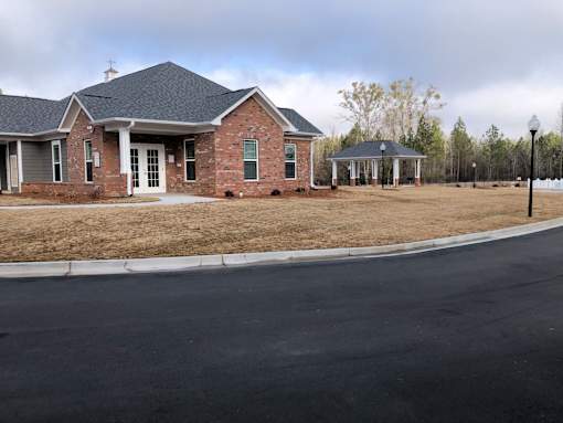 A house with a brick facade and a covered porch.