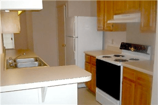 A white oven and sink in a kitchen.