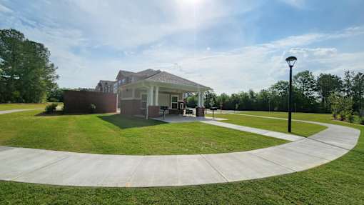 A house with a circular driveway in front of it.
