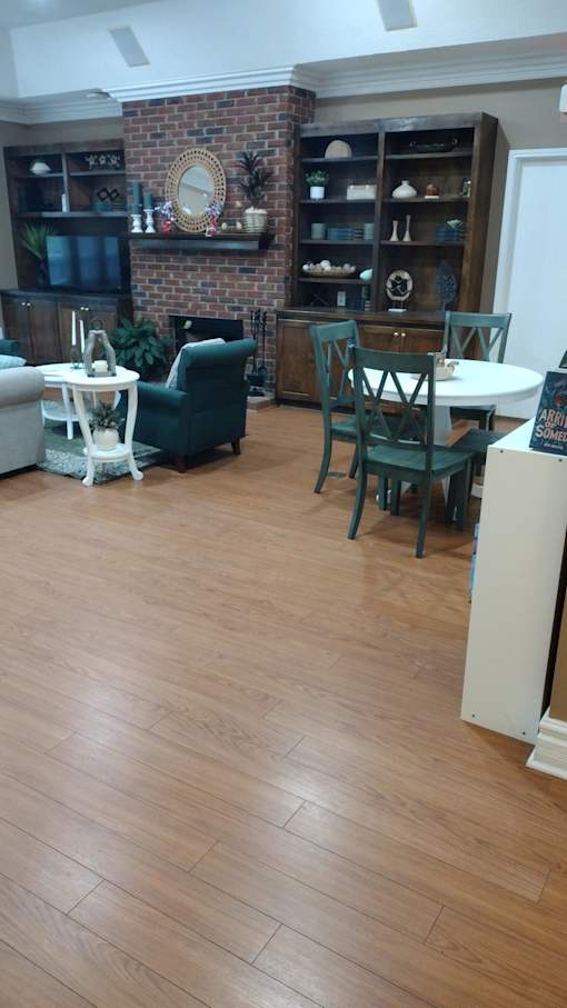 A living room with a couch and a chair.