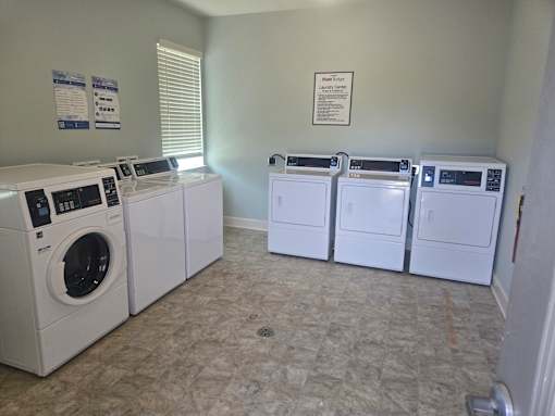 A laundry room with a washer and dryer in it.