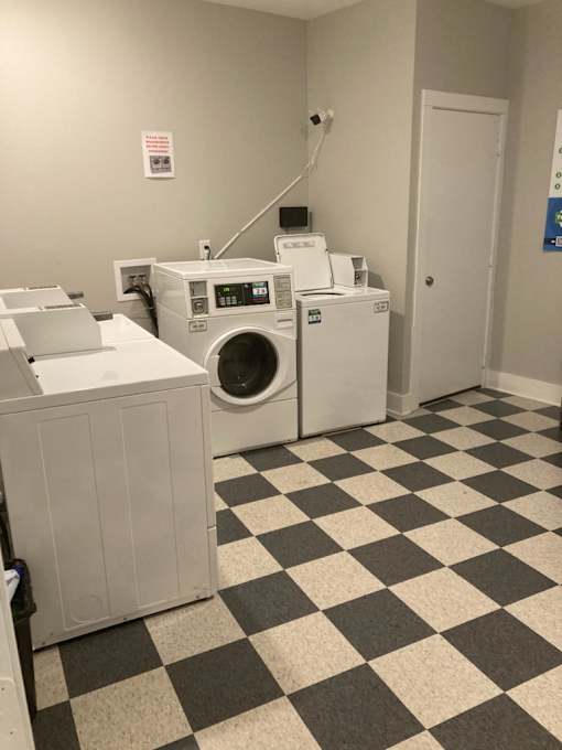 A laundry room with a washer and dryer.