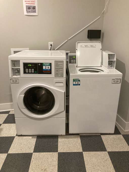 A washer and dryer are sitting next to each other.