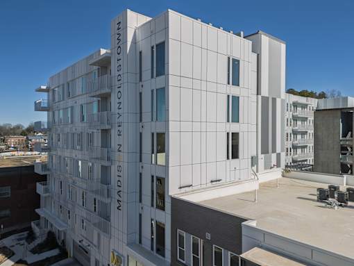 A white building with the words "MADISON PREYNOLDS" on the side.