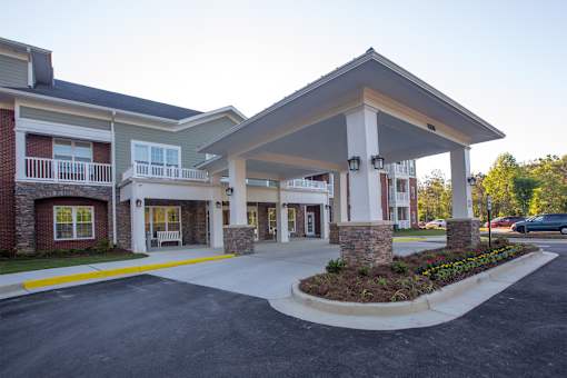 A building with a covered walkway entrance.