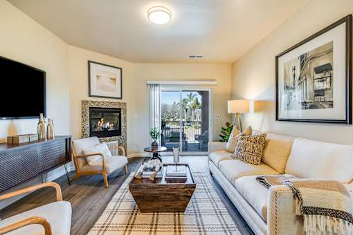 A living room with a fireplace and a couch.