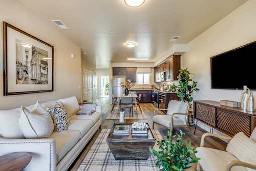 A living room with a white couch and a coffee table.