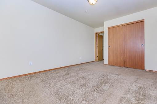Spacious bedroom with carpeting and closet at Monroe Avenue Apartments, Salem, Oregon