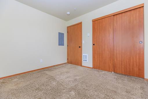 Bedroom with carpeting and large closet at Monroe Avenue Apartments, Salem, OR 97301