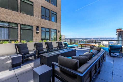 an apartment patio with a pool and lounge chairs at Napoleon Apartments, Washington, 98402