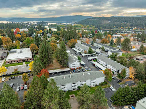 A view of a parking lot and buildings from above. at Ironwood Apartments, Coeur dAlene