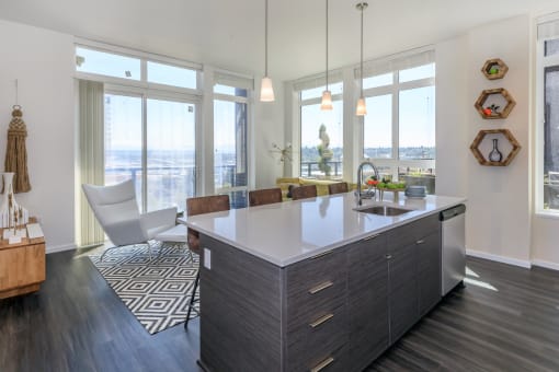 an open kitchen with a large island and a view of the city at Napoleon Apartments, Washington, 98402