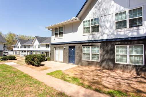 A white house with a blue door and windows at Barcelo at East Cobb Apartments, Marietta, Georgia
