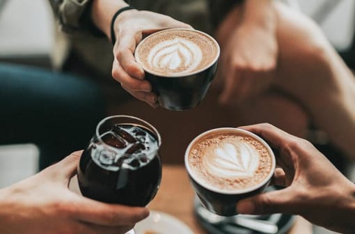 a group of people holding cups of coffee at Monroe Avenue Apartments, Salem, Oregon
