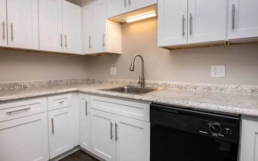a bathroom with a sink and a mirror at Cleo Apartments, Alabama, 35611