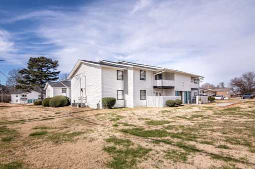 a white house with a yard in front of it at Cleo Apartments, Athens, 35611