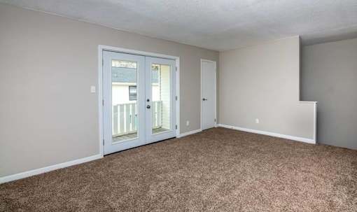 Carpeted Living Area at Cleo Apartments, Alabama, 35611