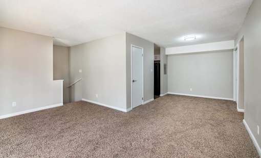 an empty room with a carpet and walls at Cleo Apartments, Alabama, 35611