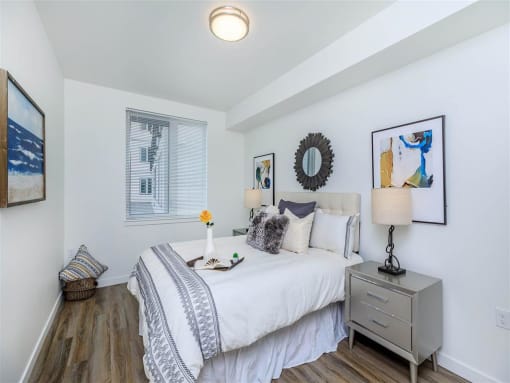 a bedroom with a bed and a dresser next to it at Jefferson Yards, Washington, 98402