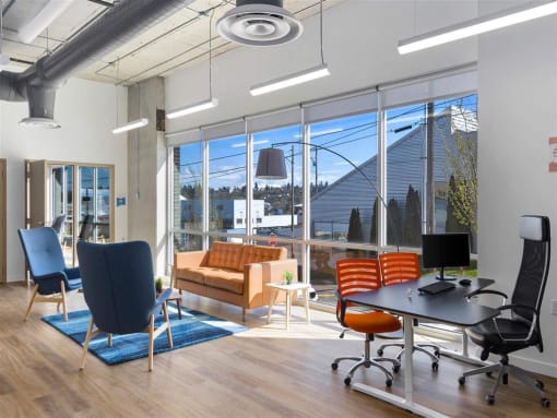 a room with a large window and a desk with a computer at Jefferson Yards, Tacoma, WA