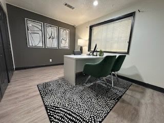 A room with a desk and a chair.