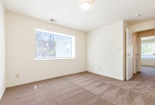 an empty room with a window and a door at Waldo Heights, Kansas City