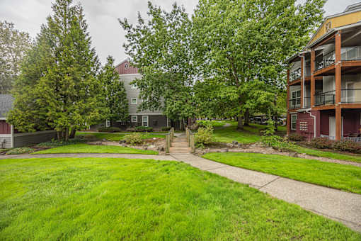A green lawn in front of a building.