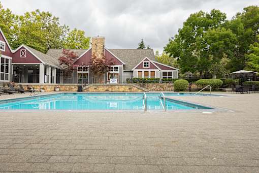 A pool in front of a house.