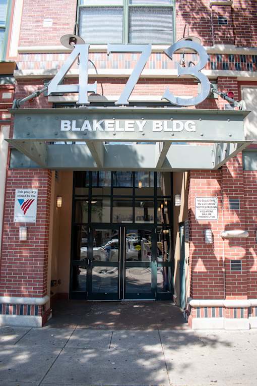 The Blakeley Building is a red brick building with a large number 473 on top.