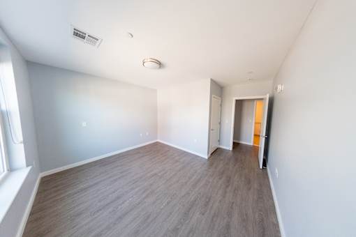 A room with a grey floor and white walls.