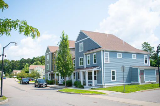 a blue house with a brown roof