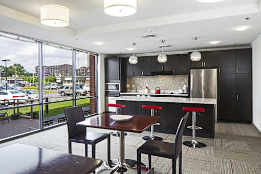 a kitchen and dining room with a view of a parking lot