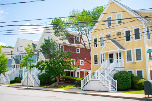 a row of colorful houses on a street