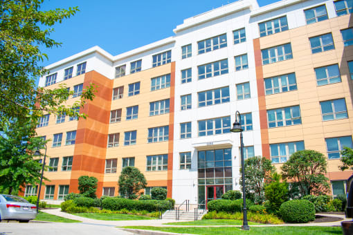 a large building with many windows and a street light in front of it