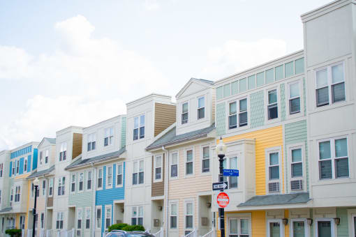 a row of colorful condominiums on a street