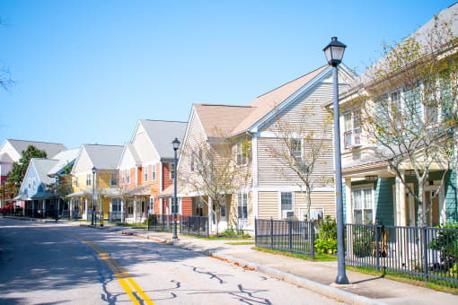 a row of houses on the side of a street