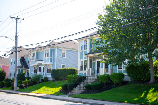a row of houses on the side of a street