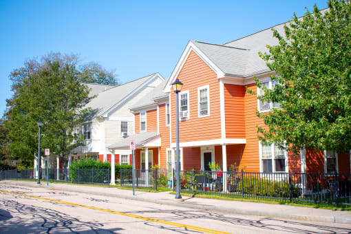 a row of houses on the side of a street